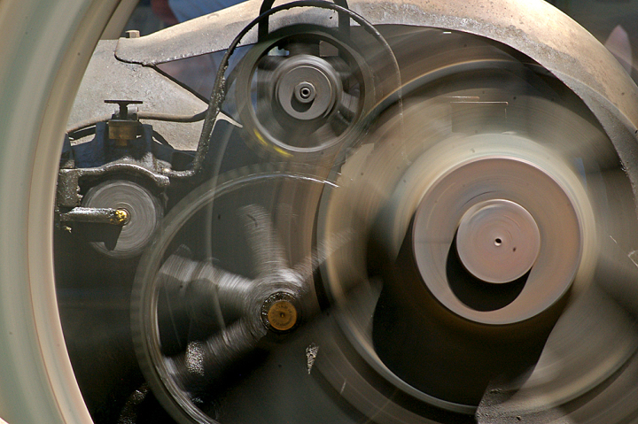 Wheels and Gears Wheels and gear on an antique hit-and-miss gasoline engine.